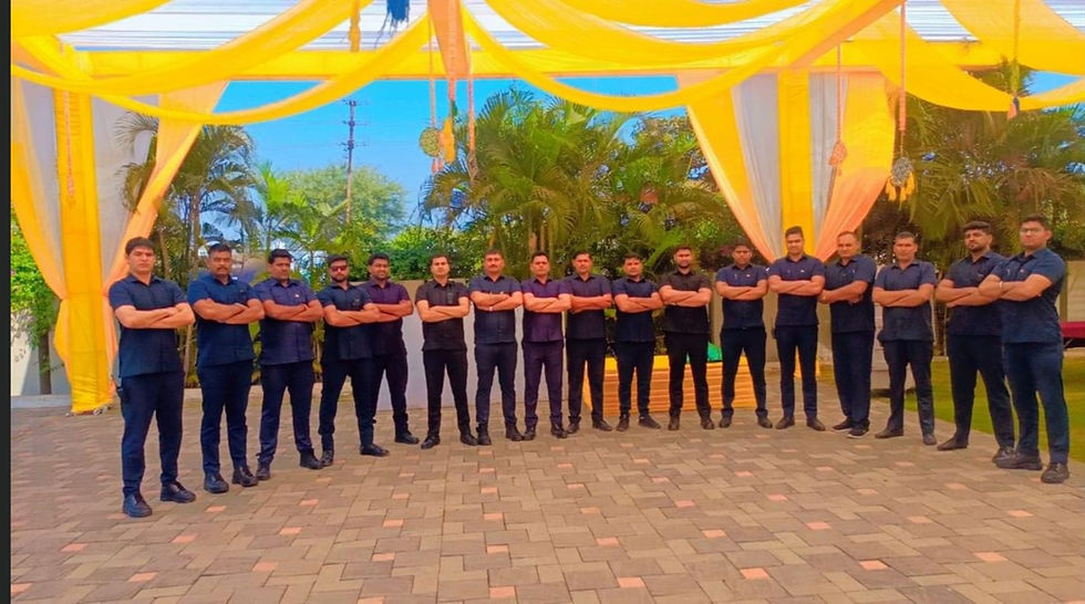 wide landscape photo of a full security team standing in a strong lineup outdoors under yellow decor, navy uniforms, trust-building
