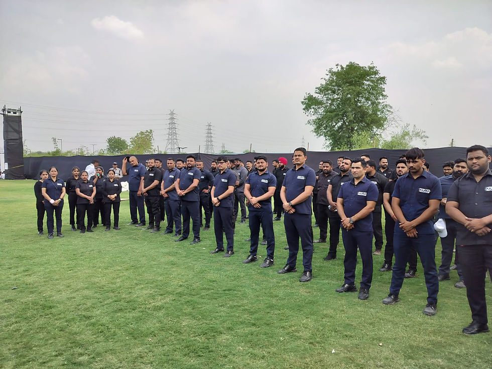 large security team standing on grass during a briefing, navy uniforms