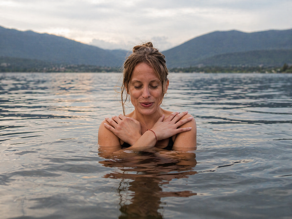 Woman dipping in water in the lake