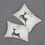 Thumbnail: Cream lumbar cushion with a dark green silhouette of a leaping reindeer with swirling antlers in a minimalist holiday design