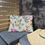 Thumbnail: Outdoor pillow with colorful watercolor wildflowers and leaves on a white background, perfect for patios.