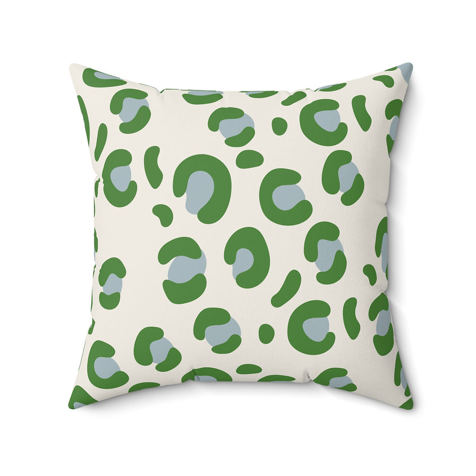 Faux suede pillow with modern green and gray leopard print on a cream background, perfect for bold and stylish home decor.