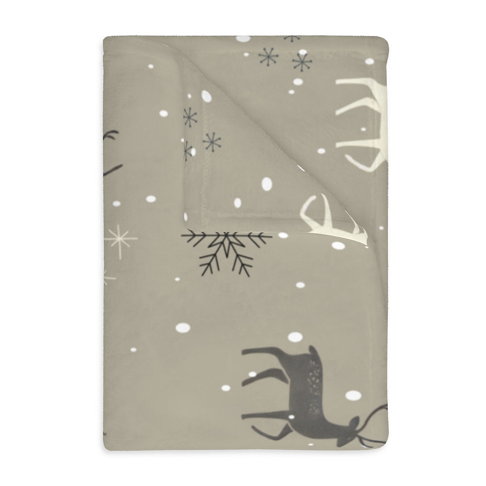 Velveteen microfiber blanket with reindeer and snowflake patterns on a grey background, perfect for holiday décor.