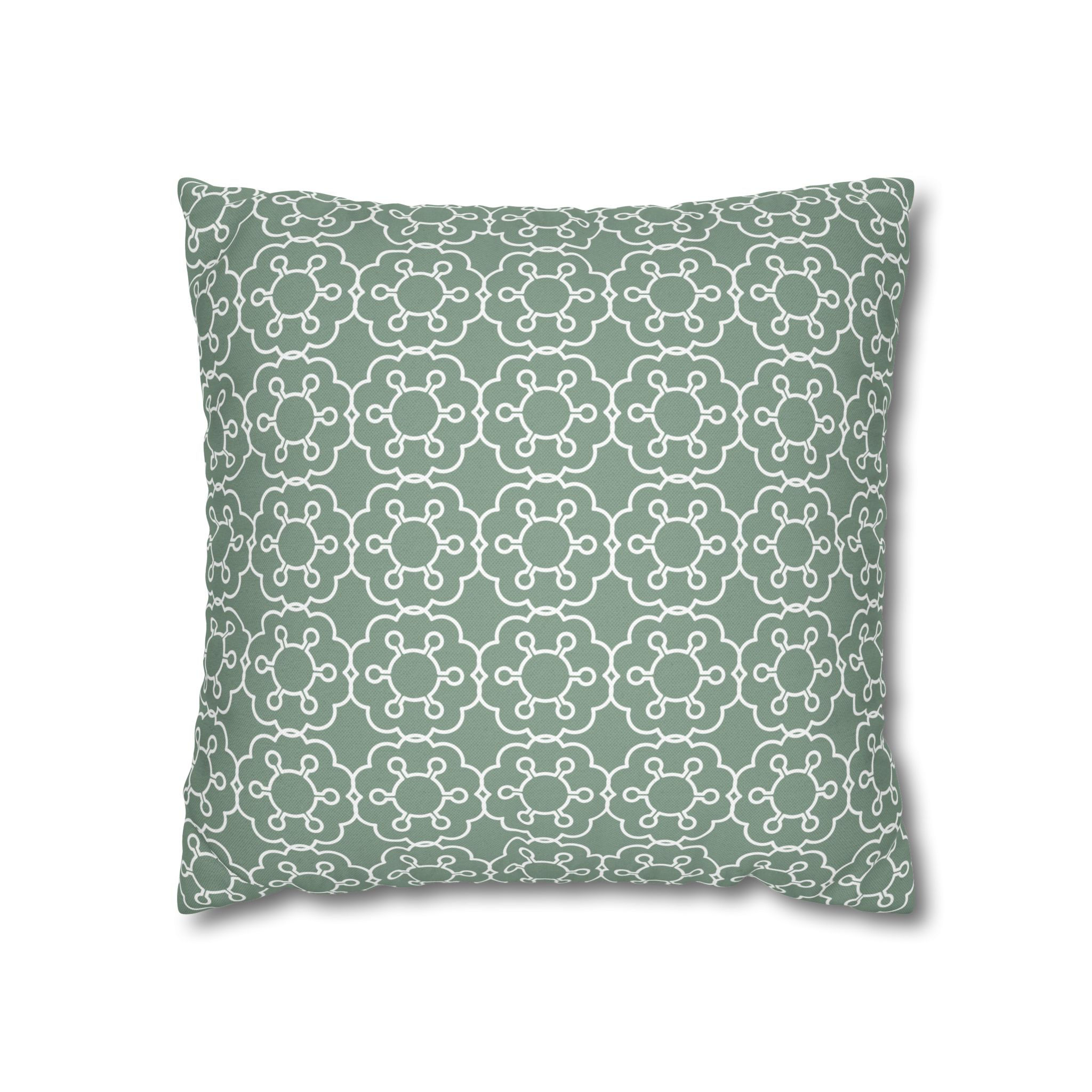Pillow cover with a repeating white floral trellis pattern on a sage green background, offering a fresh & elegant design.