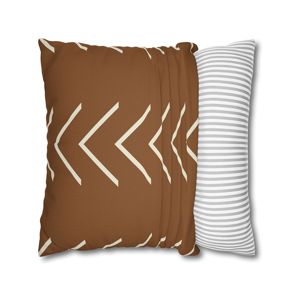 Brown cushion cover with cream tribal chevron pattern inspired by mudcloth design, perfect for boho or southwestern style.