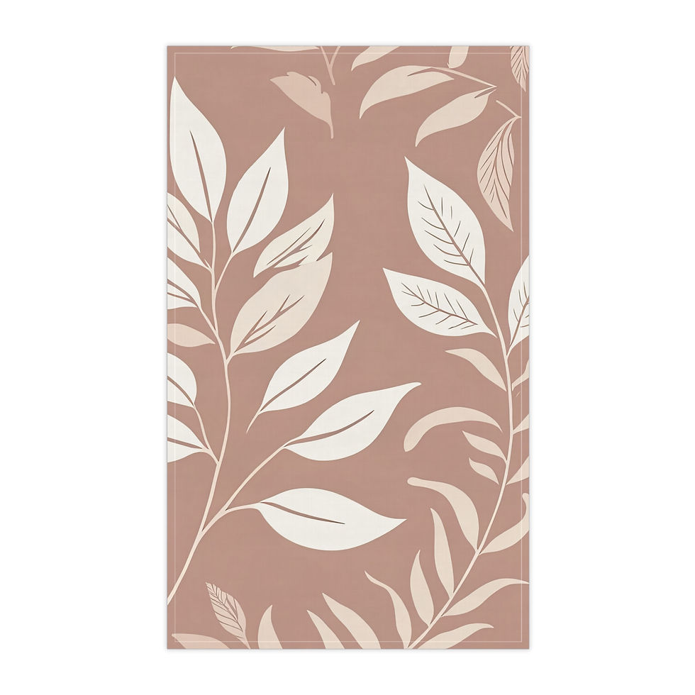 Tea towel with a botanical leaf pattern in cream on a warm terracotta background, hanging in a modern kitchen.