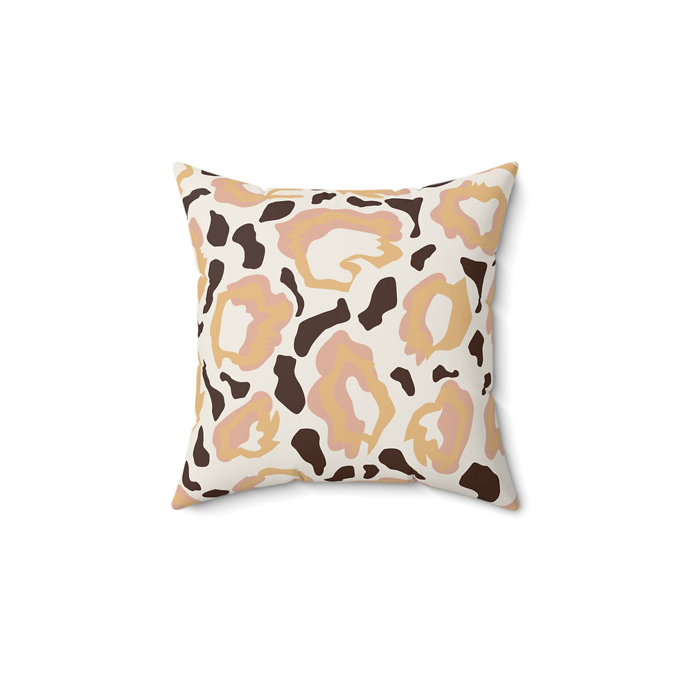 Faux suede pillow with blush, tan, and brown leopard print pattern on ivory background for modern or playful interiors.