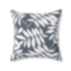Decorative cushion with white leaf silhouette pattern on dark indigo blue background