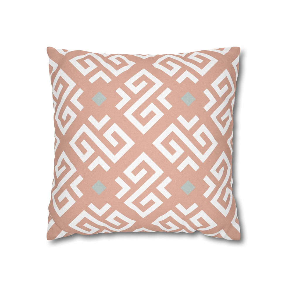Square pillow with peach geometric diamond patterns and light blue accents on a white background.