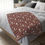 Thumbnail: Velveteen microfiber blanket with white wildflowers, green leaves, and red berries on a burgundy background in a holiday flor