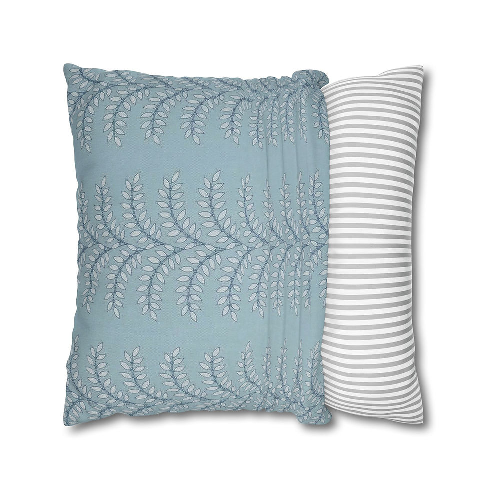 Light blue square cushion featuring three vertical rows of delicate white leafy vines.