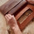 Thumbnail: 100% plantaardig gelooid leren dames clutch kleur bruin 2 vakken met 2 kleuren leer gevoerd camel en rood.