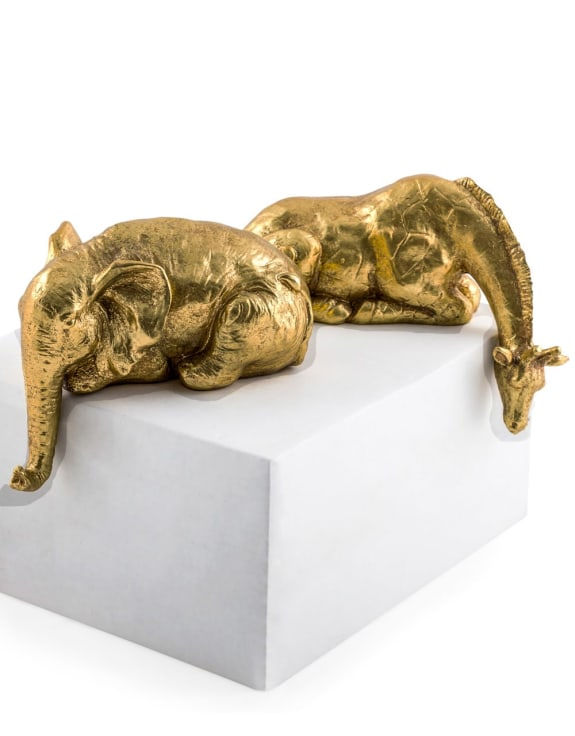 Thumbnail: Gold Peering Over Elephant and Giraffe Ornaments
