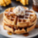 fluffy round homemade waffles and powdered sugar with syrup drizzled ontop no fruit no fru