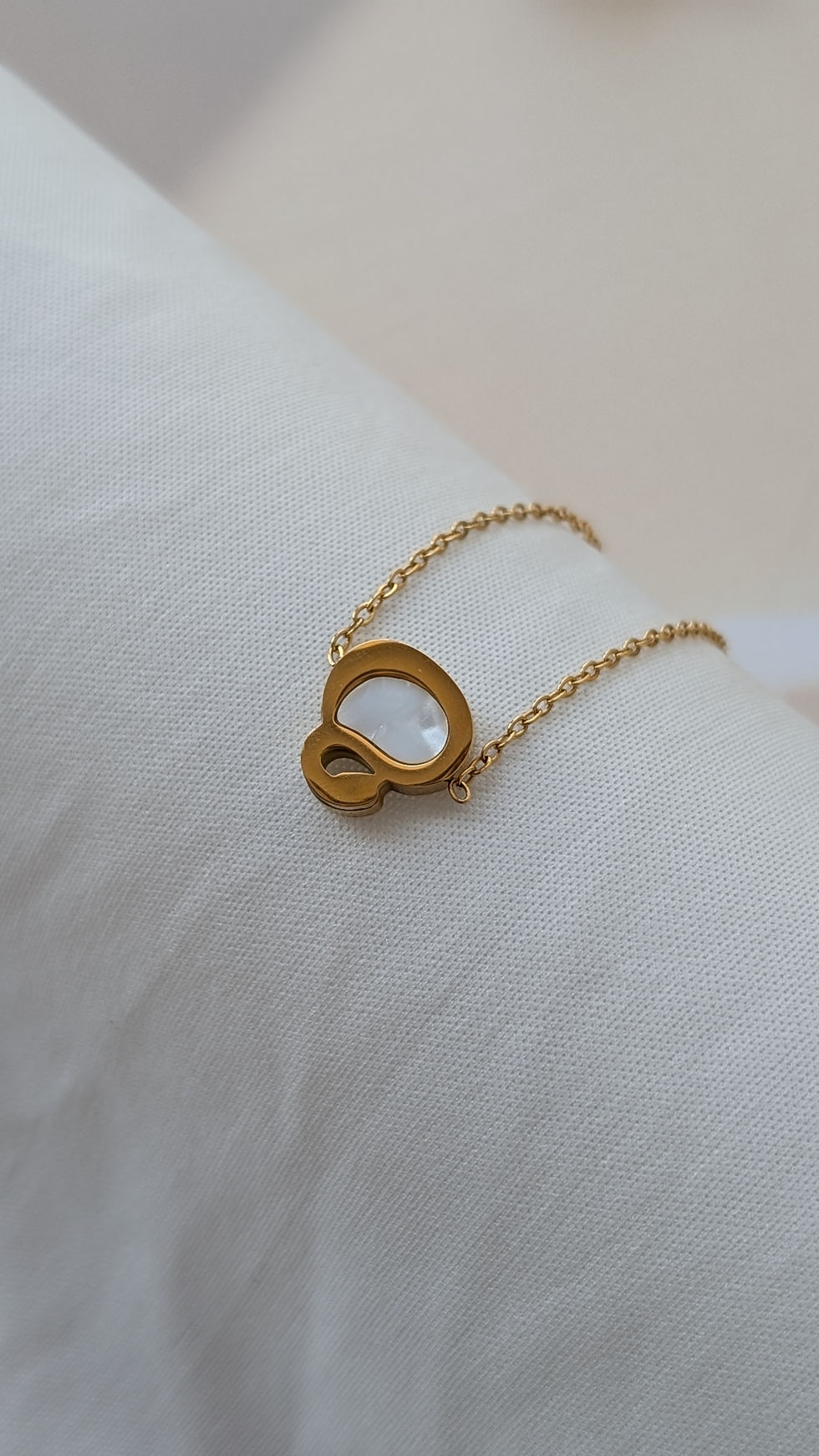 Thumbnail: Reversible Gold Bracelet with Black & White Charm