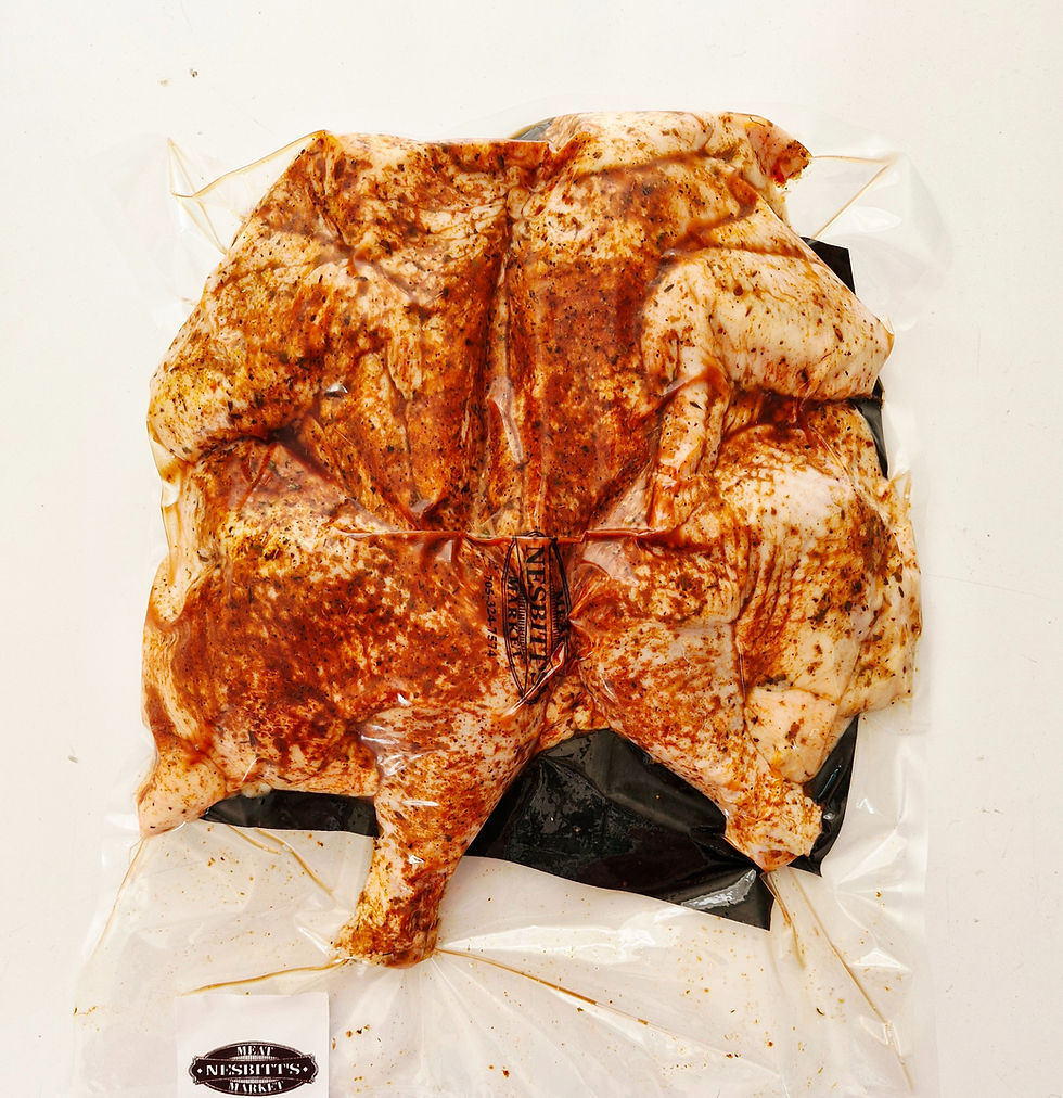 dry rub marinade on a flattened chicken
