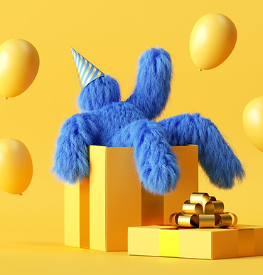 Boneco azul peludo sentado na caixa de presente amarela gigante com balões amarelos voando 