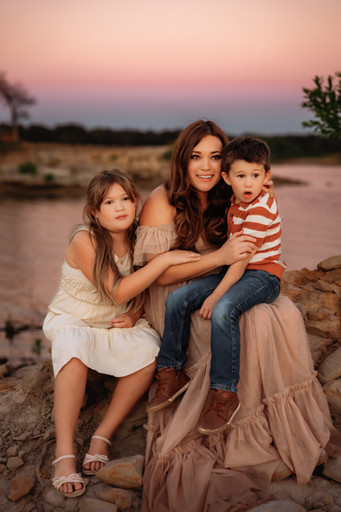 mom and her 2 kids snuggling at sunset for their fall family photos with precious gems photography