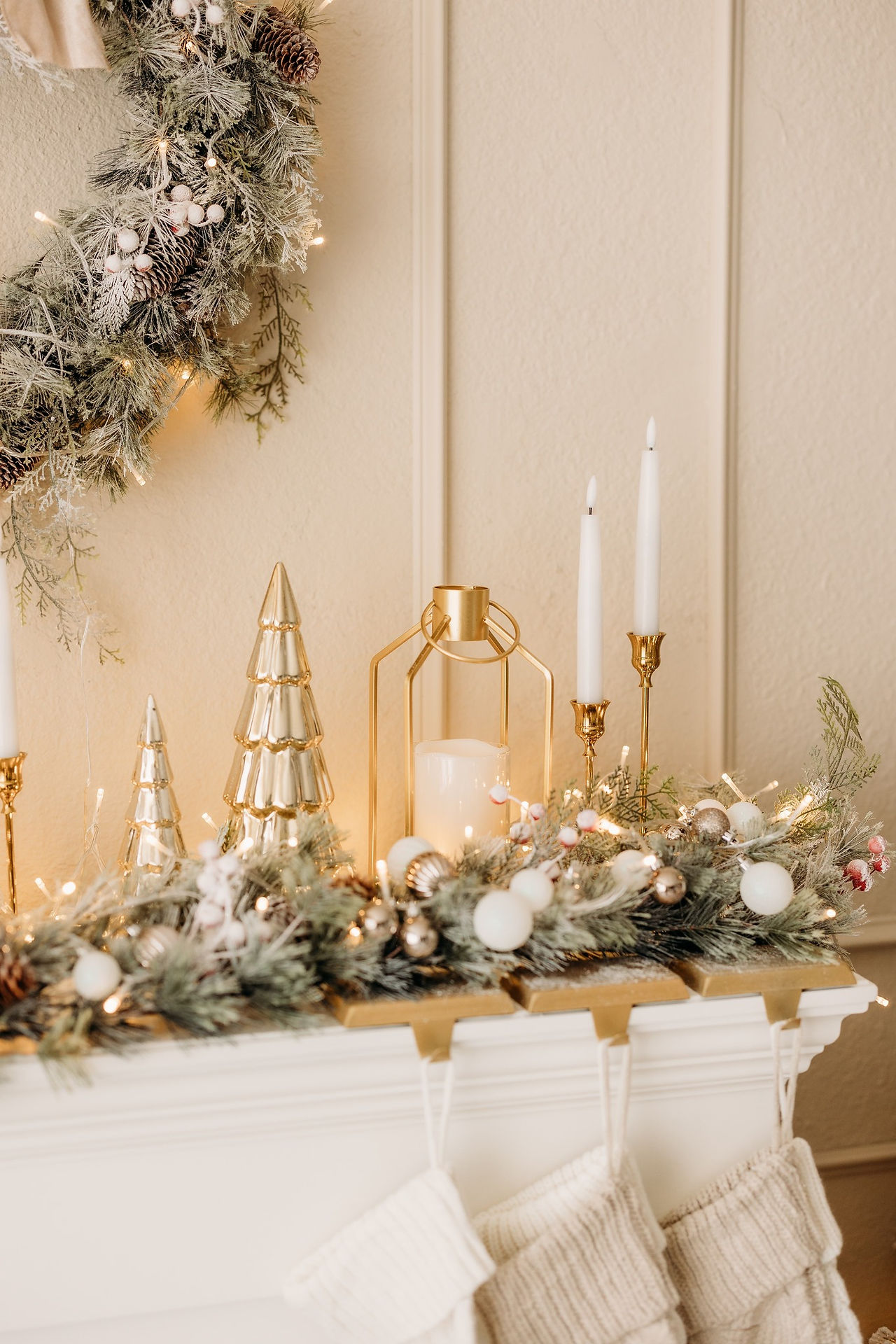 Elegant flocked Christmas tree with gold and white ornaments and wrapped presents beside a fireplace – Saginaw TX Christmas studio mini sessions by Precious Gems Photography.
