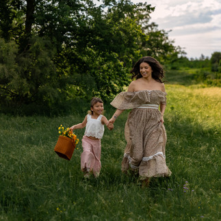 Fort Worth Mommy and Me wildflower session with dreamy sunset lighting, colorful blooms, and rustic flower basket