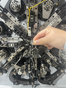 product in front of spring machine.HEIC
