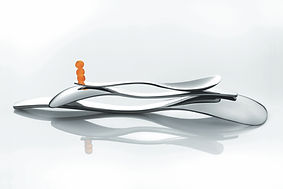 Spoons on a reflective surface