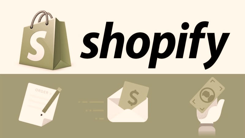 "An illustration of a desktop computer screen displaying a beautifully designed Shopify website homepage with product images, navigation menu, and a prominent call-to-action button."
