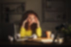 Stressed out woman sitting at her desk