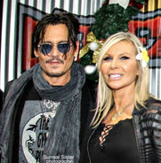 on the red carpet, Johnny Deppa dn artist Stacey Wells.