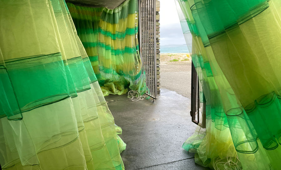 Hebaska is both the Cornish word for calm and new work that transformed the Fly Loft, a cavernous space previously used for storing pilchards, above Newquay Harbour. During this installation, the public were invited into the fly cellars, a (usually locked) cavernous storage vault built into the rocks overlooking #newquayharbour . Exposed to the elements, the voluminous fabric billowed and breathed with the wind, enveloping the viewer and dramatically changing the context of the space. The mass of material together with the sound of the violin acted as a a porous veil to the sea, offering a cocoon, a sanctuary.