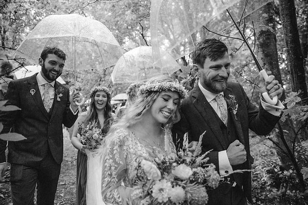 Outdoor wedding in Devon with umbrellas