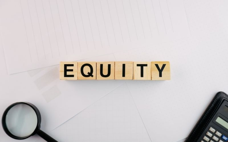 Home equity concept represented by wooden letter blocks spelling "EQUITY"—a key strategy for investing in property through My Finance Agent mortgage brokers.