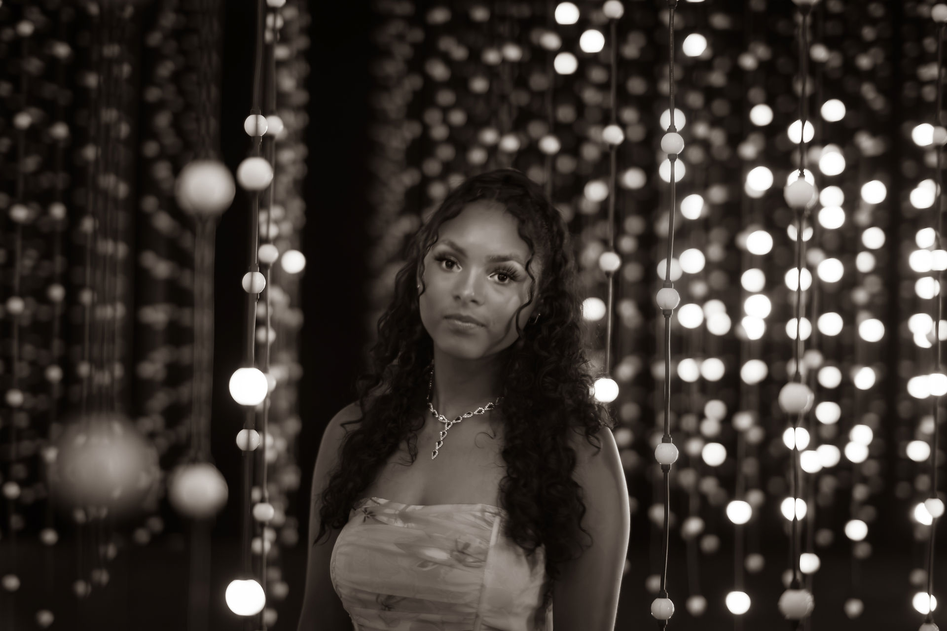 A Liberty Hill High School Senior stands in the art installation Submergence at Wonderspaces