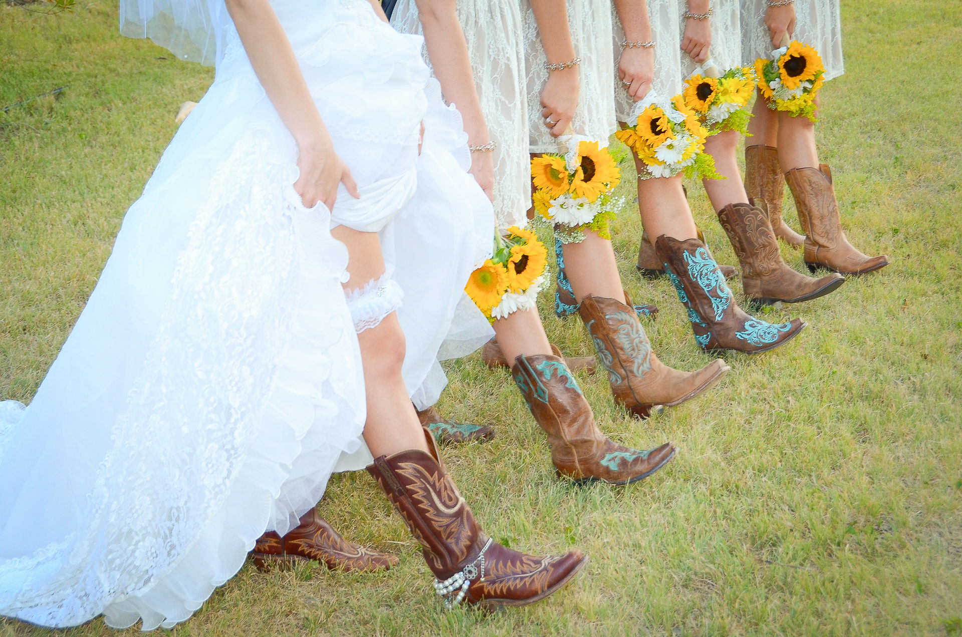 A Texan bride and bridesmaids show off their boots for the wedding.