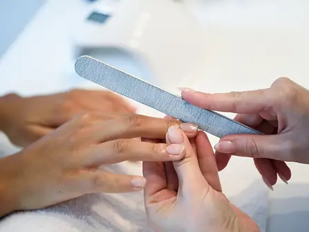 woman-nails-salon-receiving-manicure-with-nail-file.webp