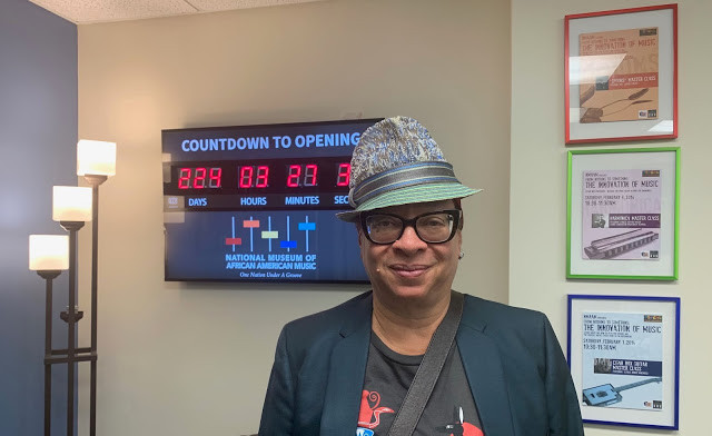 Nina Kennedy in front of the Countdown to Opening clock
