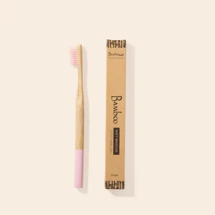 Thumbnail: Pink bamboo toothbrush with packaging