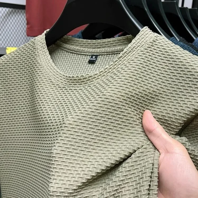 Close-up of light green waffle-knit fabric