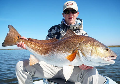 Captain Bates Holding Giant Redfish