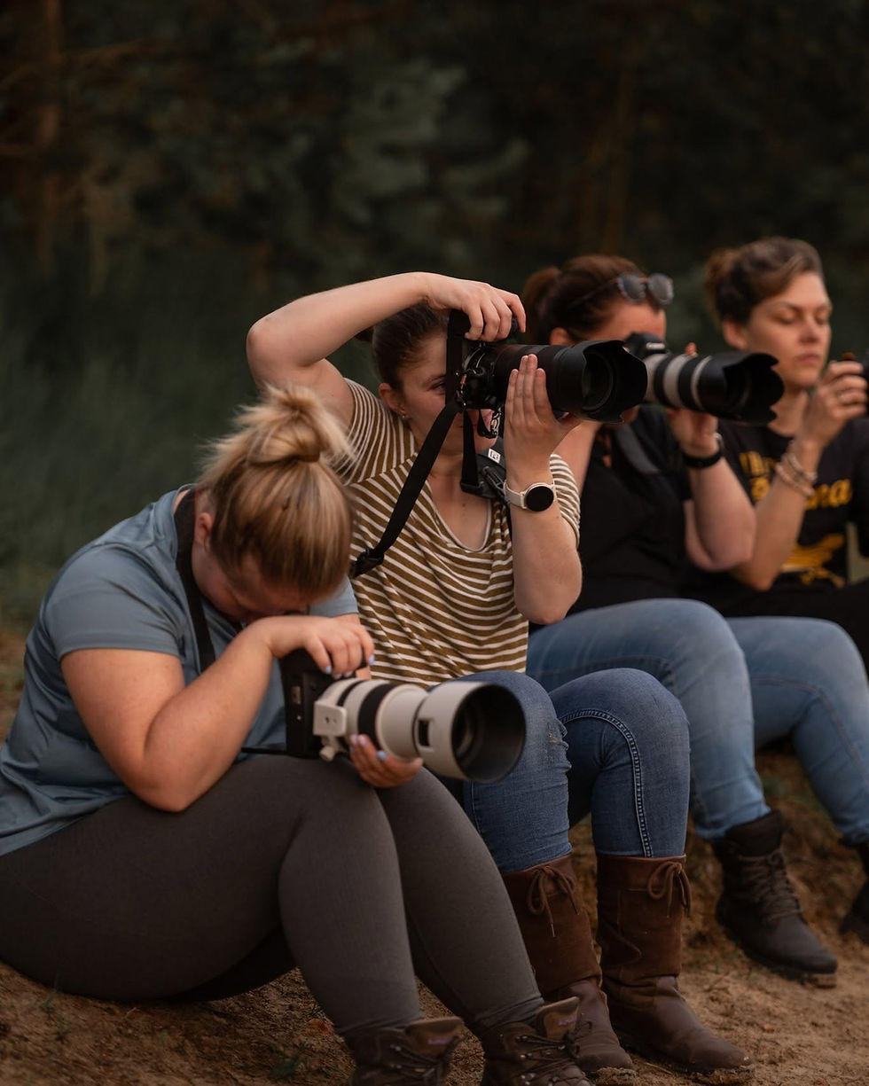 Photographers photographing together during a group photoshoot