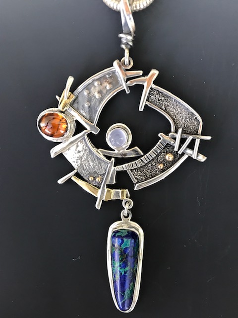 Azurite Pendant Hand-fabricated from sterling silver and 18K gold, this pendent includes an azurite