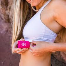 Thumbnail: Female runner applying Body glide for her under bra stap