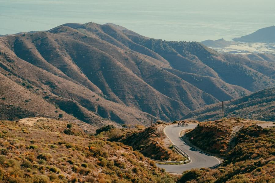 group of cyclists tacking a high mountain pass