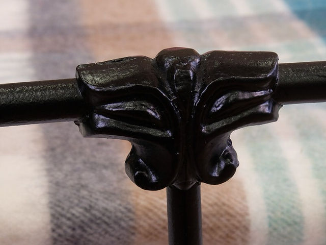 antique metal bed with knopped etailing