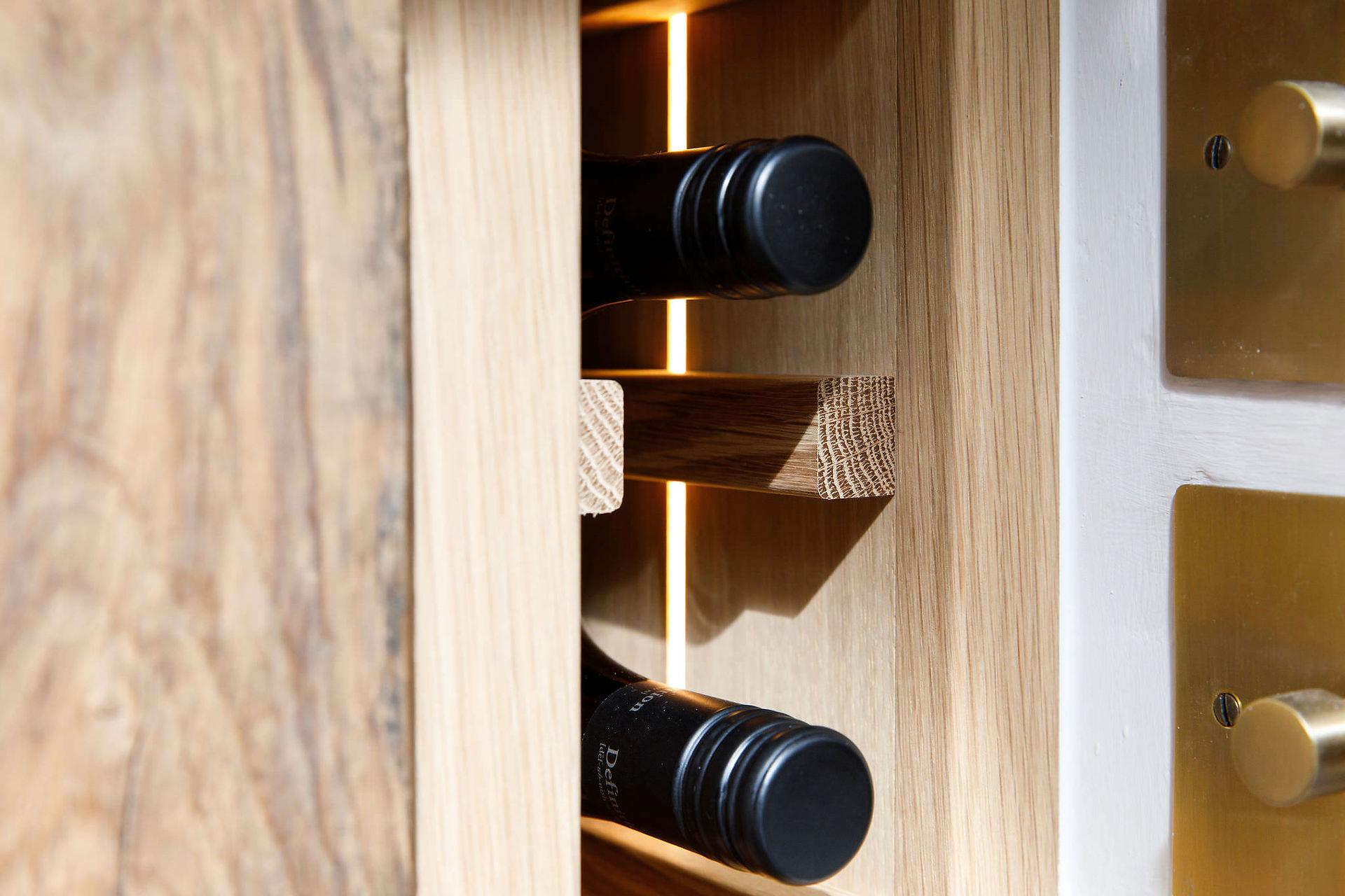 Solid oak wine rack detailing bespoke fitted in Bracklesham Bay, West Sussex, UK