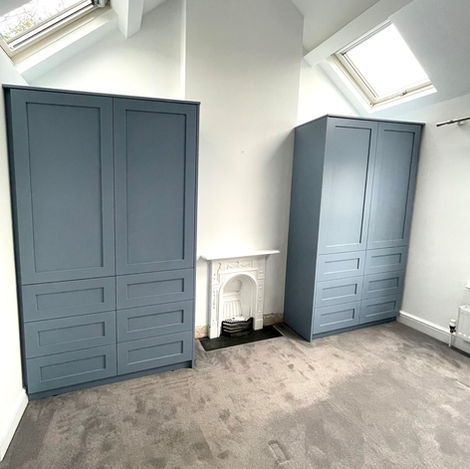 blue wardrobes in loft conversion