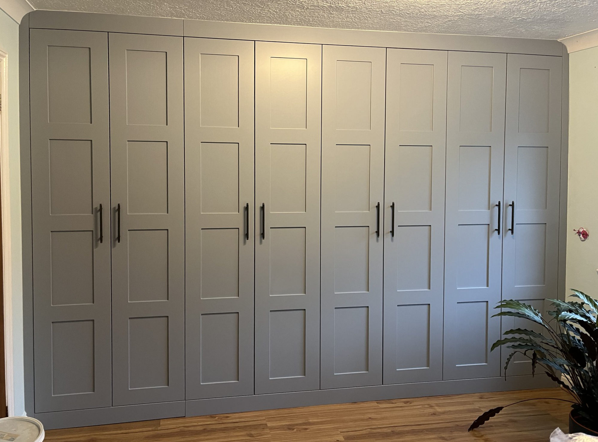 Four grey shaker wardrobes with T shaped handles in Sussex