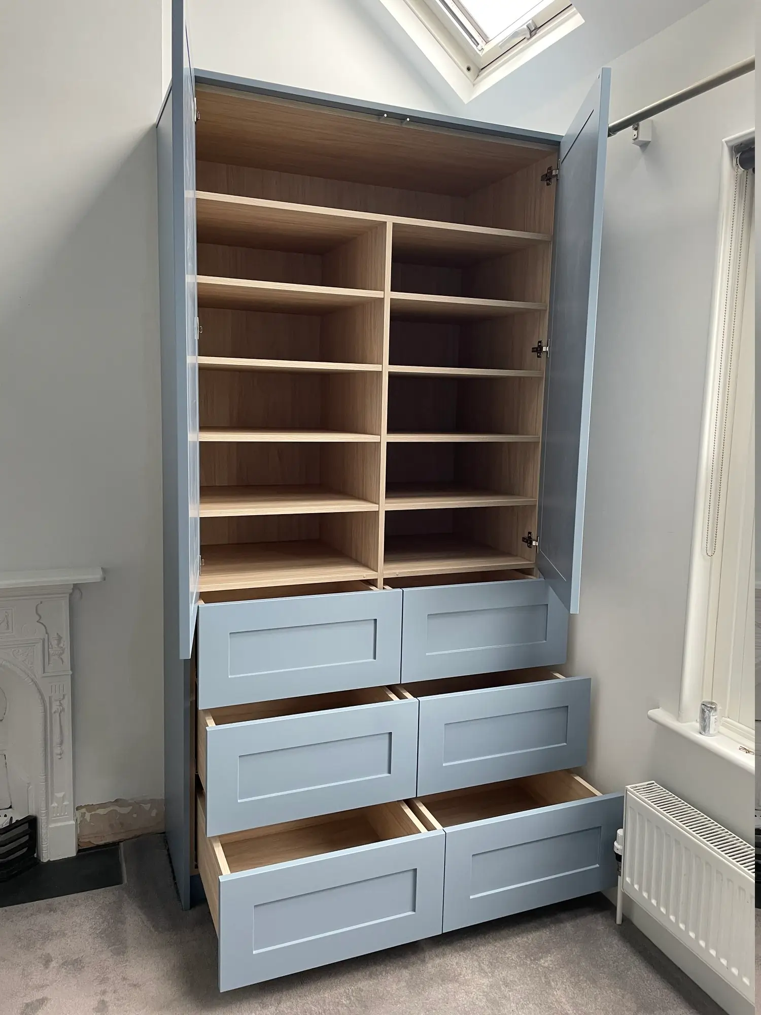 Right wardrobe with blue doors and oak style interior