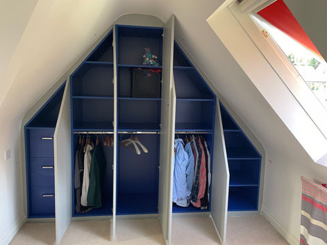 royal blue wardrobe interior in loft space