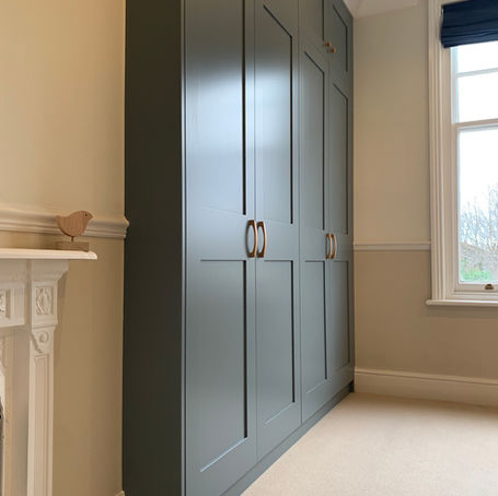 Blue Shaker Wardrobes in alcove